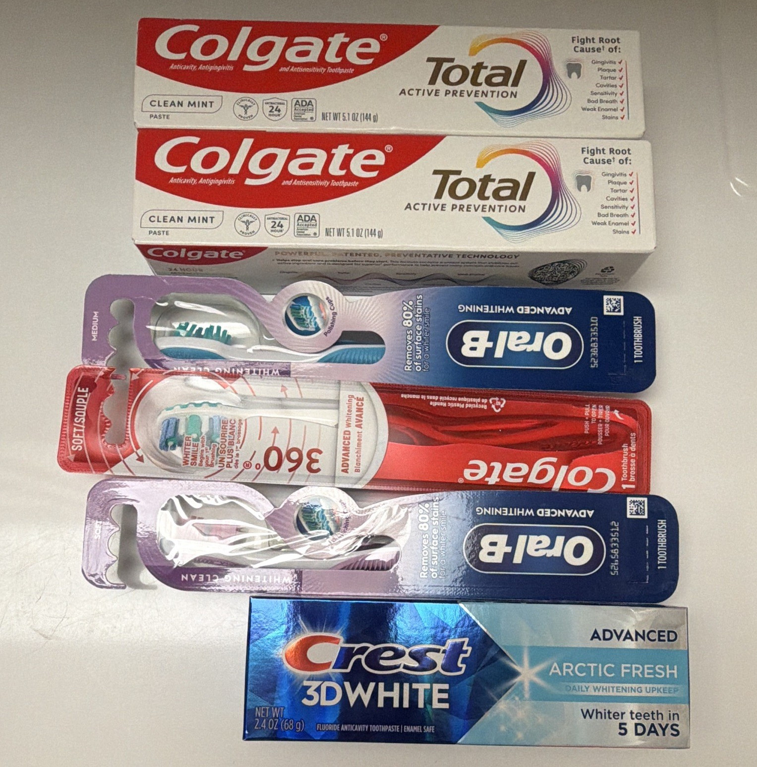 Colgate Total Clean Mint & Crest 3D White Arctic Fresh + Oral-B Toothbrush Lot