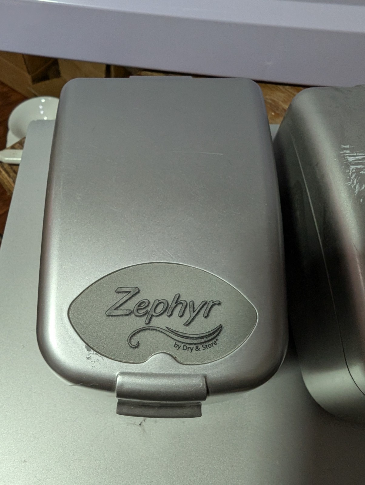 Two Zephyr by Dry & Store, an electronic dehumidifier